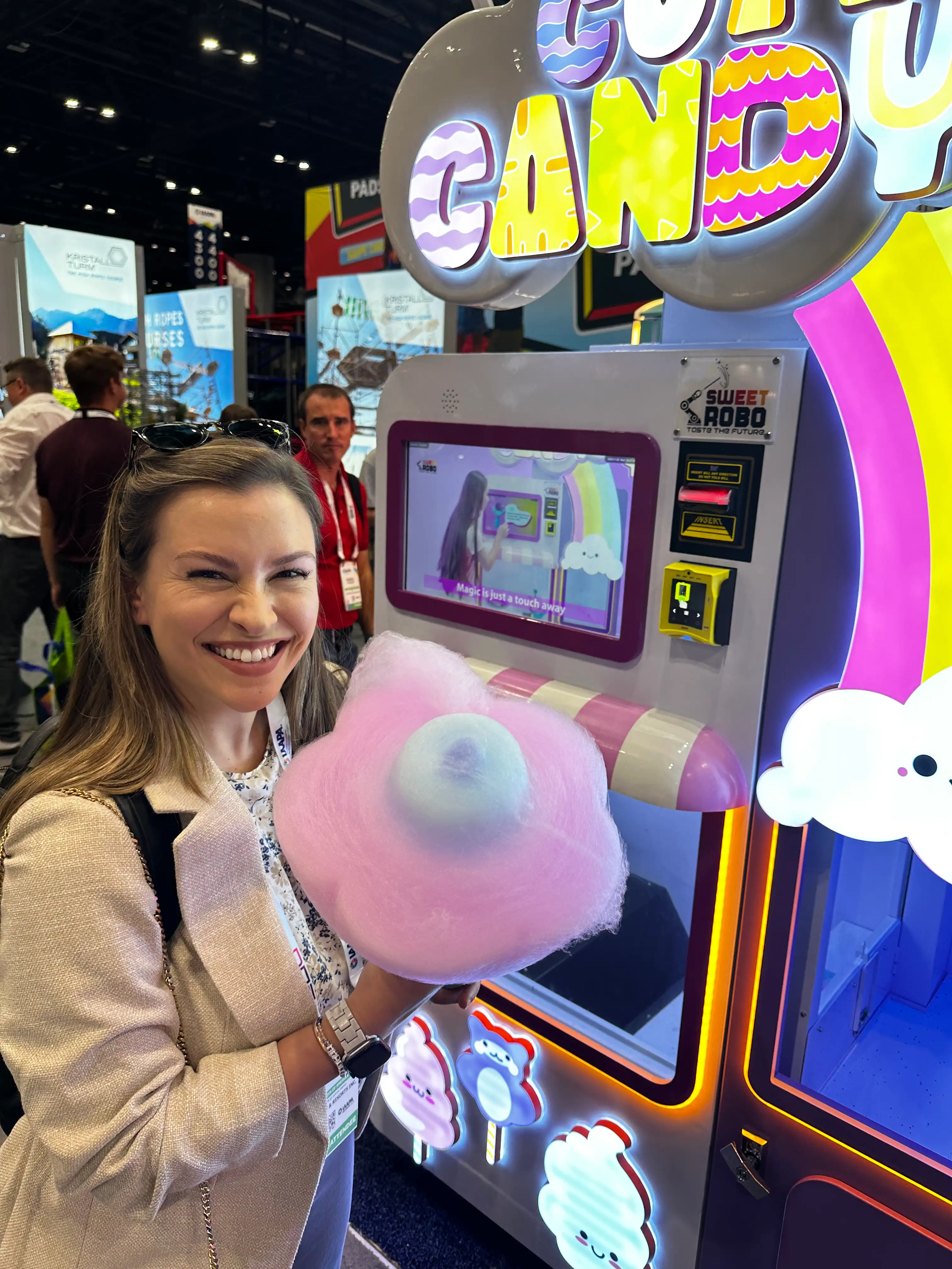 Happy customer with cotton candy at a trade show
