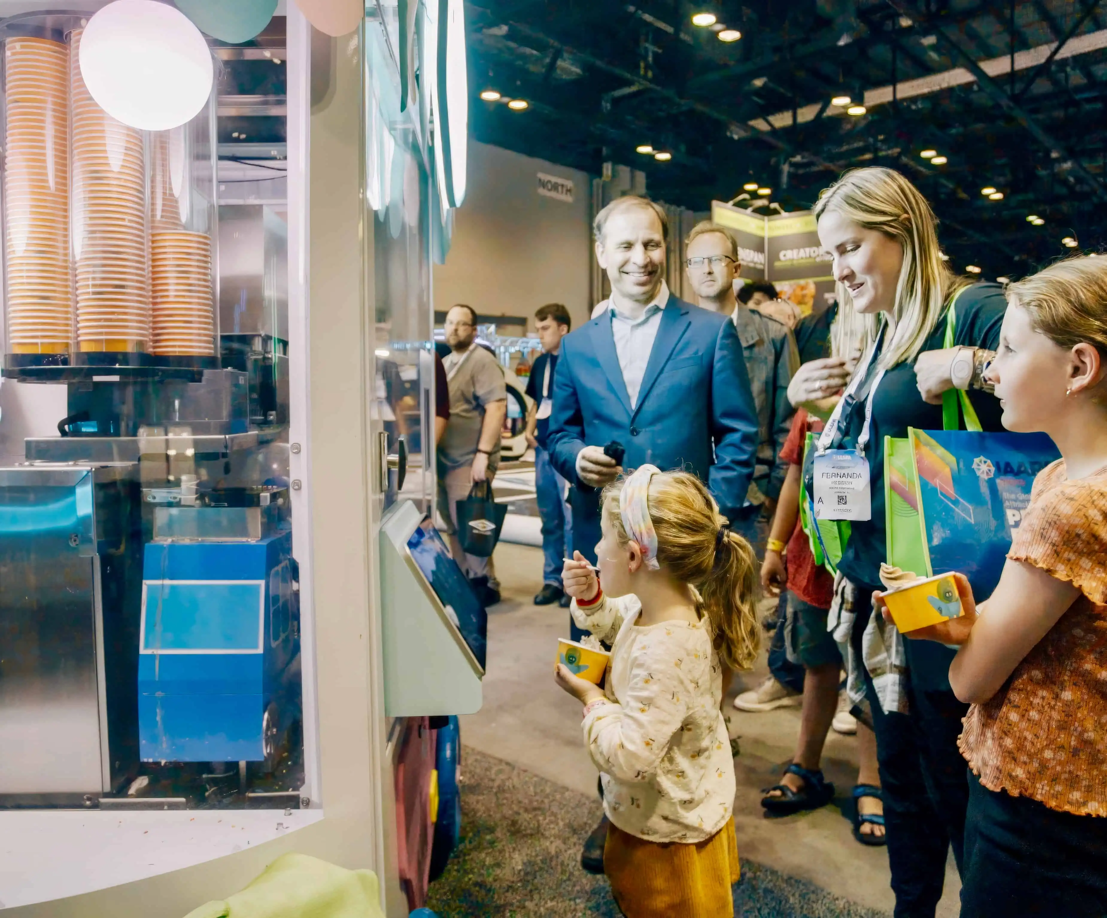 Crowd gathered around the Robo Ice Cream at a trade show